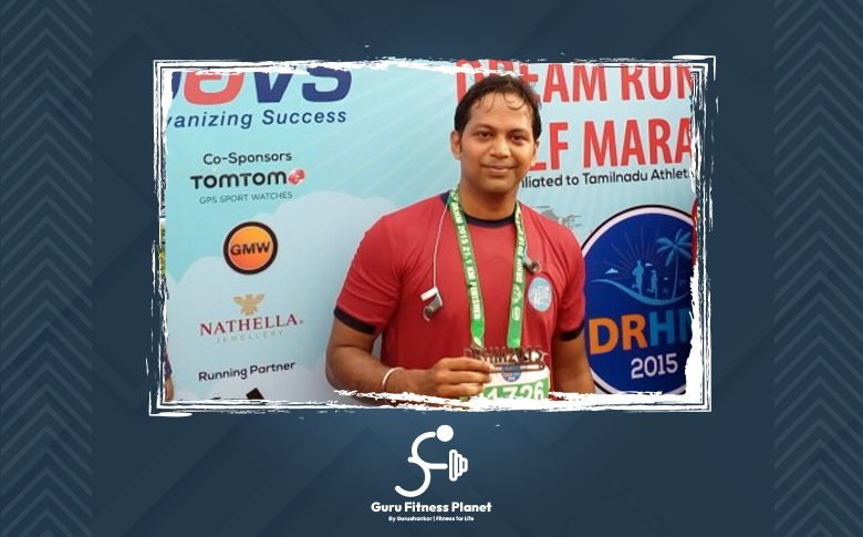 Gurushankar with his medal at a marathon