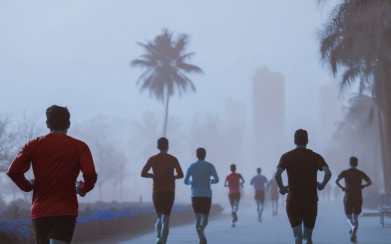 Community runners on a misty morning road